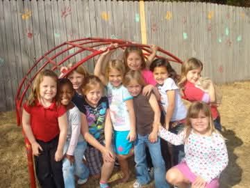 Children playing together on the playground at C.O.R.E Daycare in Palmetto FL